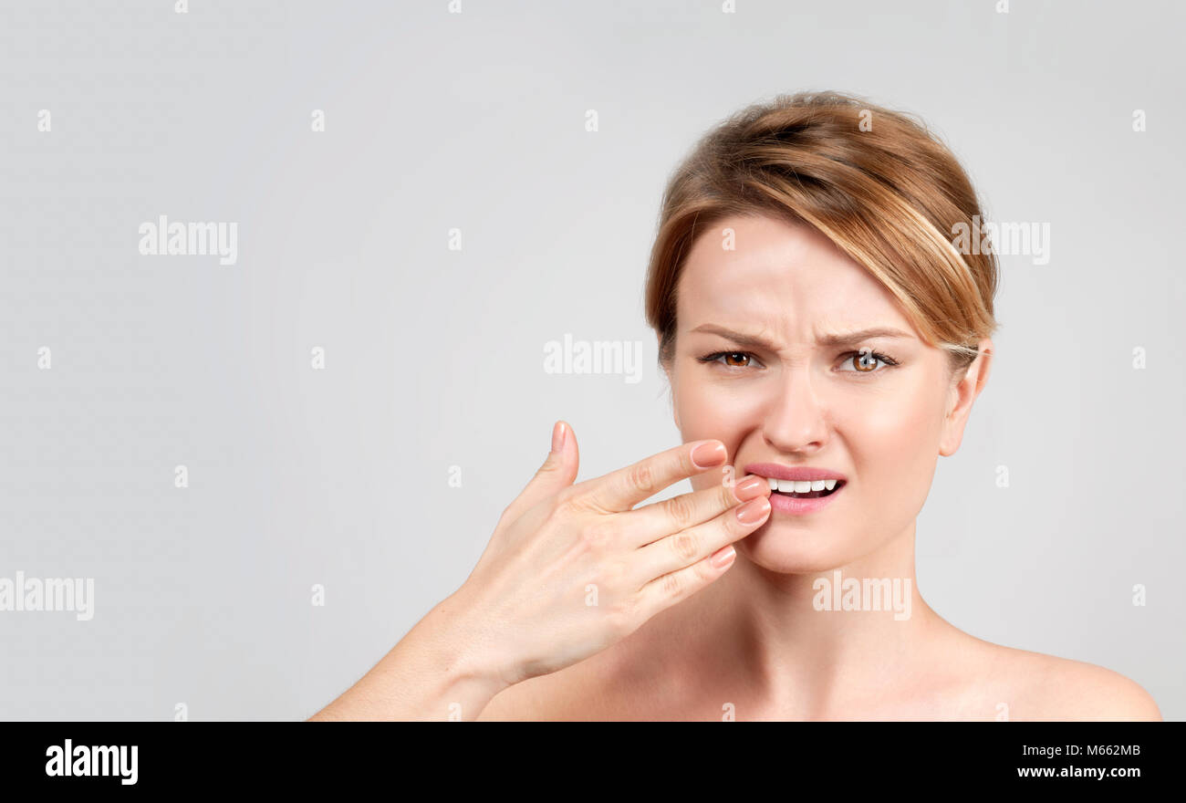 Tooth pain and dentistry, woman feeling strong toothache Stock Photo