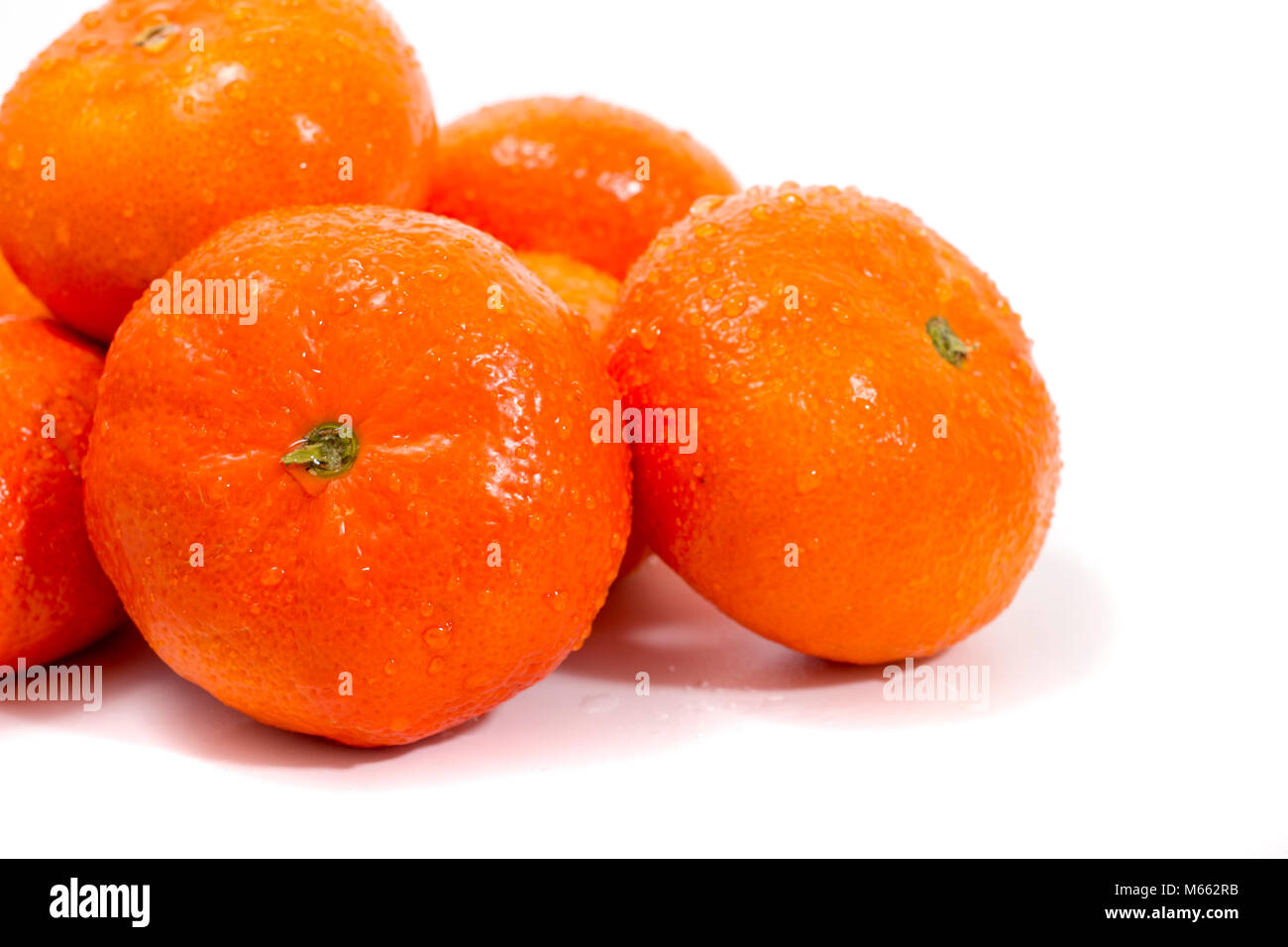 Wet clementines fruits isolated on a white background Stock Photo Alamy