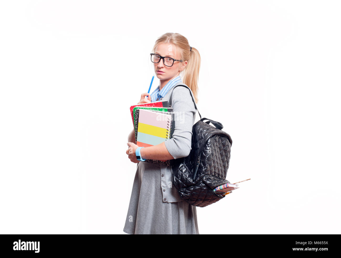 Happy young student girl holding books, standing isolated on white ...