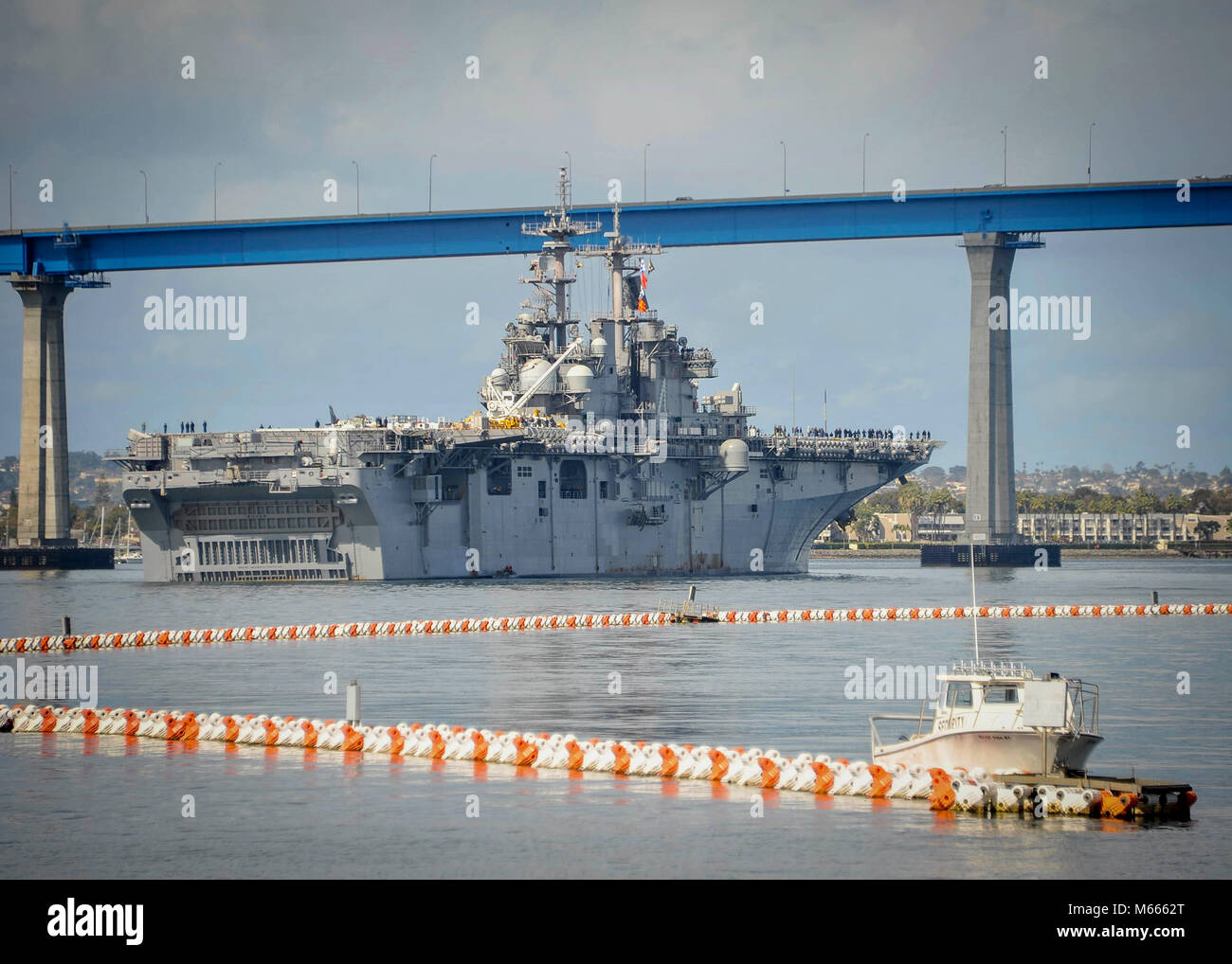 SAN DIEGO (Feb. 27, 2018) Amphibious assault ship USS Boxer (LHD 4) approaches the Coronado Bridge while transiting the San Diego Bay. Boxer is currently underway off the coast of Southern California conducting contractor sea trials. (U.S. Navy Photo by Mass Communication Specialist 2nd Class Jesse Monford/RELEASED) Stock Photo