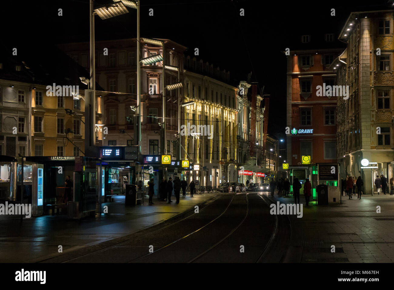 Graz, Austria - 08.02.2018: People waiting on the tram in the main square of the town Stock Photo