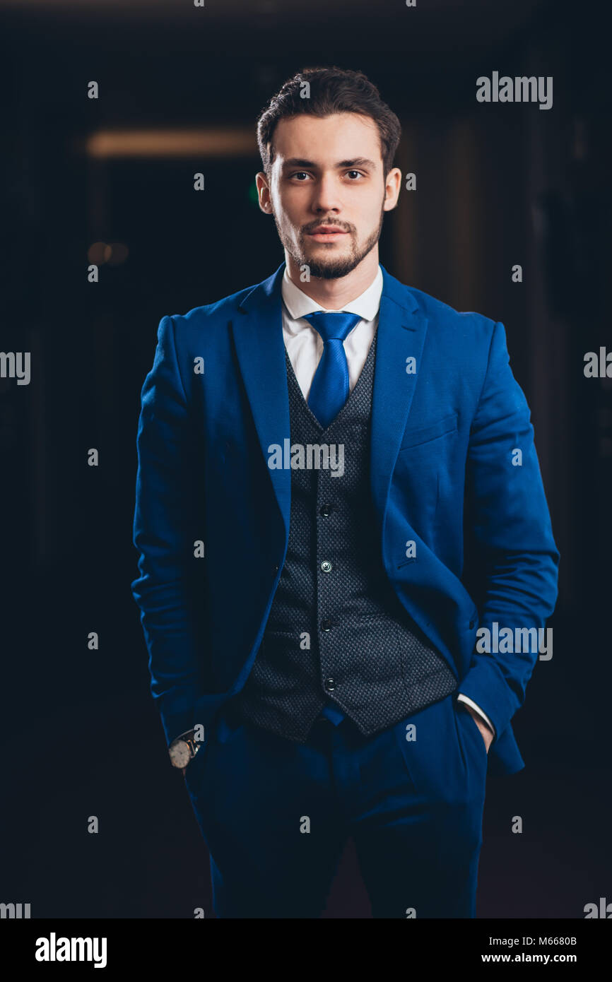 happy businessman with arms crossed standing in office Stock Photo - Alamy