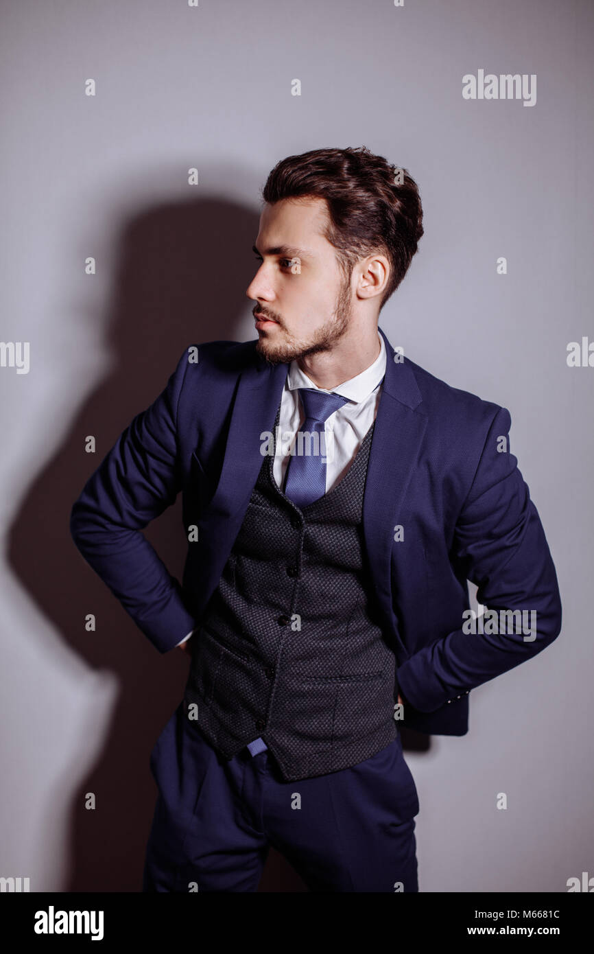 happy businessman with arms crossed standing in office Stock Photo - Alamy