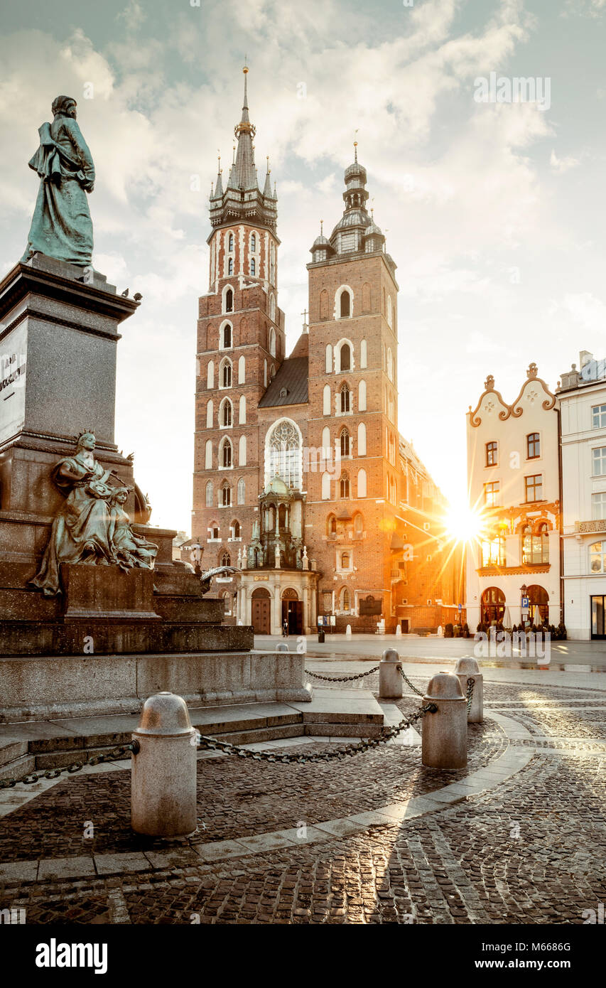 Adam Mickiewicz monument and St. Mary's Basilica on Main Square in Krakow, Poland Stock Photo