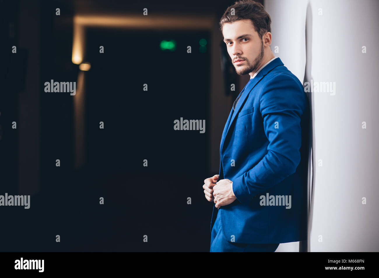 happy businessman with arms crossed standing in office Stock Photo - Alamy