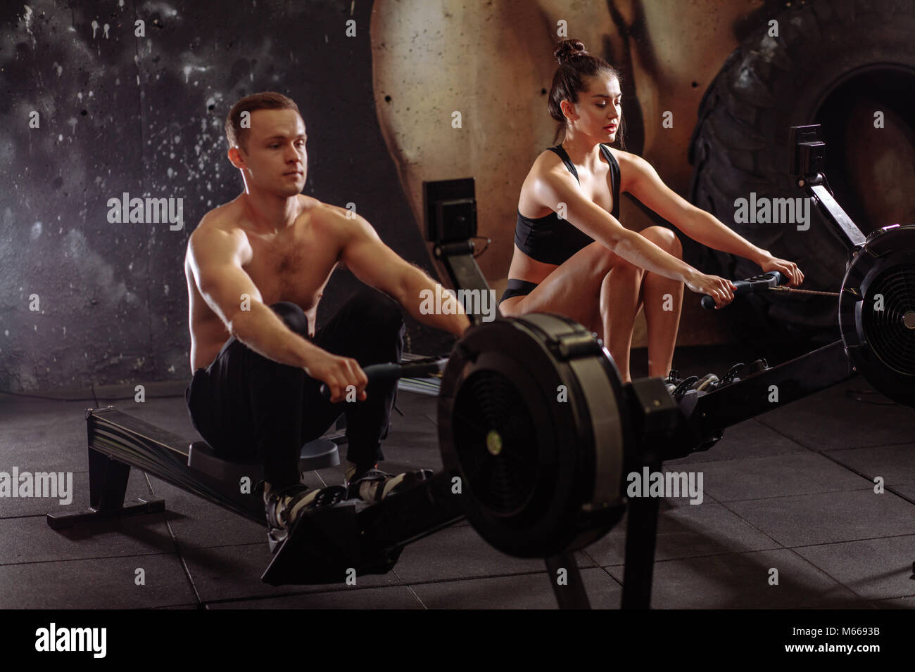 Focused woman rowing machine hi-res stock photography and images - Alamy