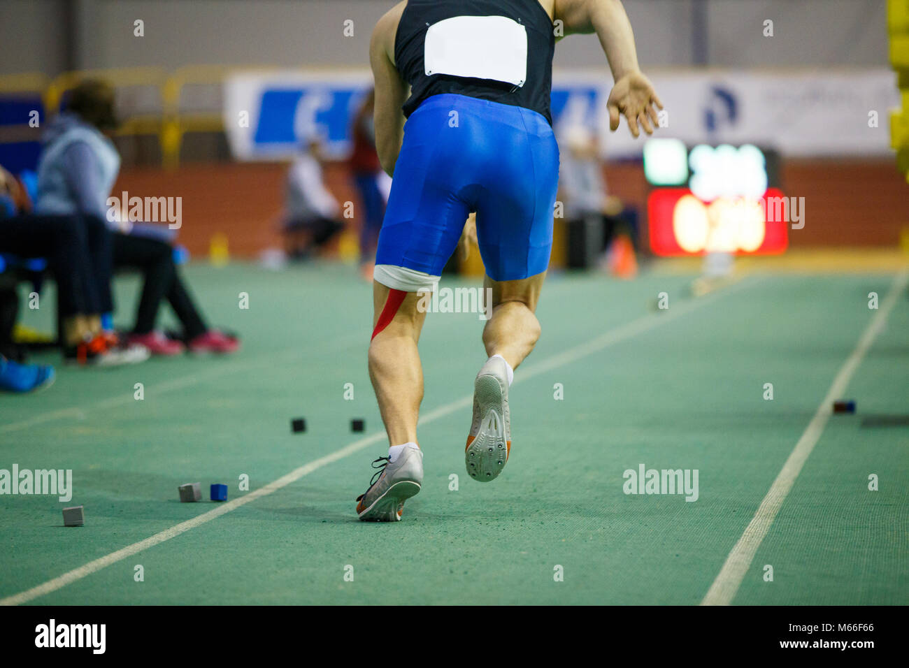 Sportsman starting acceleration in long jump competition. Track and
