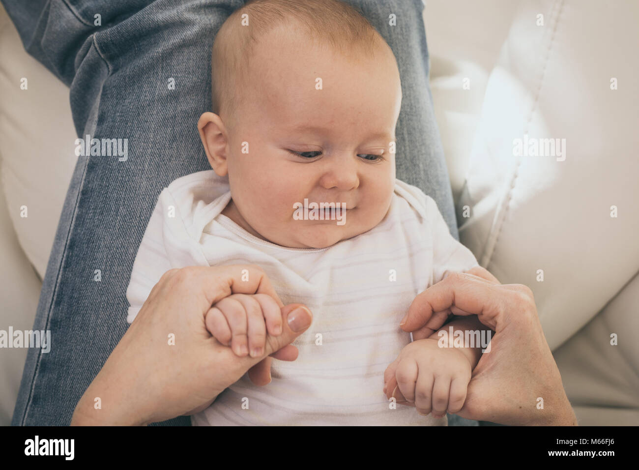 Mother holding sweet baby boy. Concept of happiness. Stock Photo