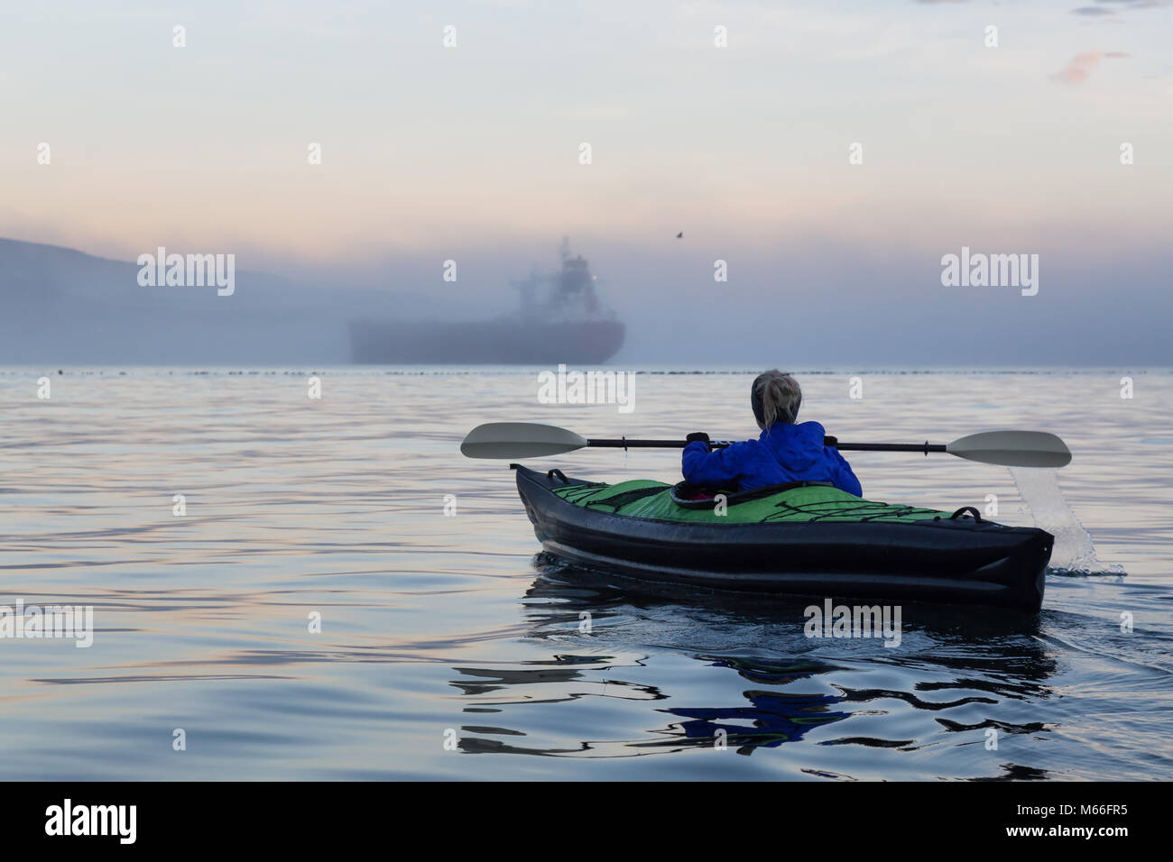 Adventure girl is kayaking on an inflatable kayak in Horseshoe Bay with