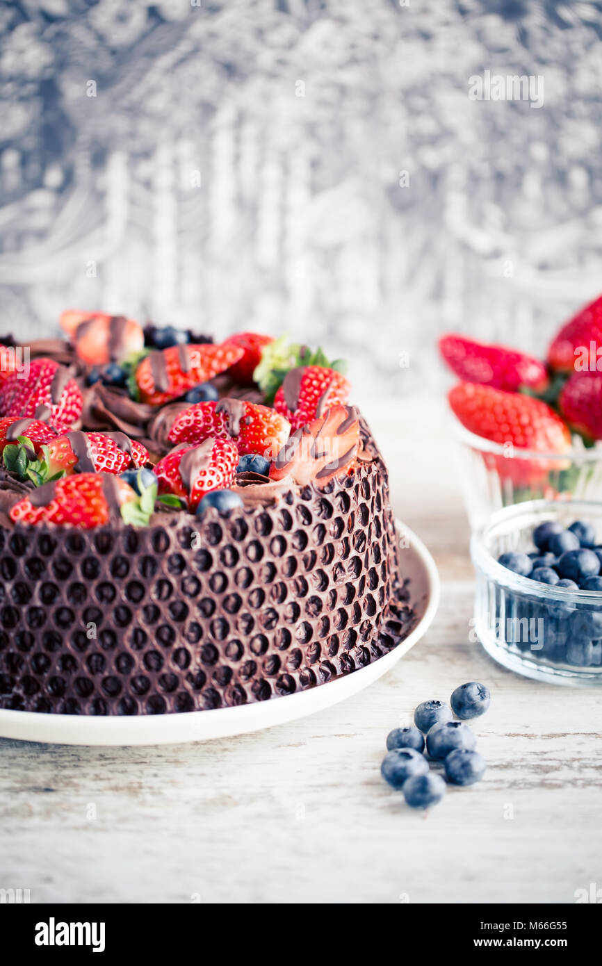 Chocolate cake with blueberries and strawberries Stock Photo - Alamy