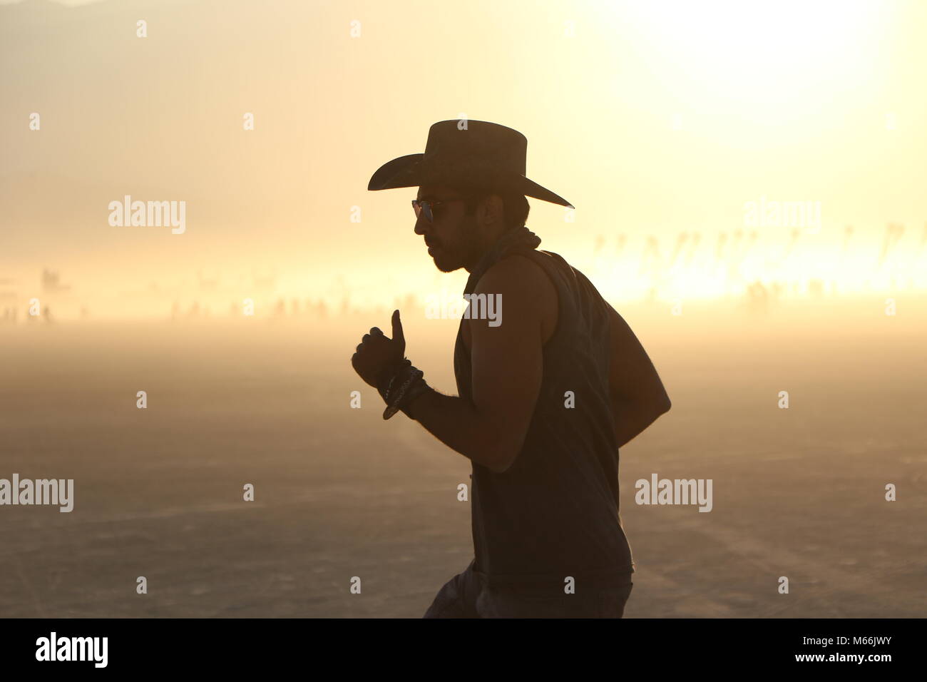 Dancing cowboy at the Burning Man festival Stock Photo
