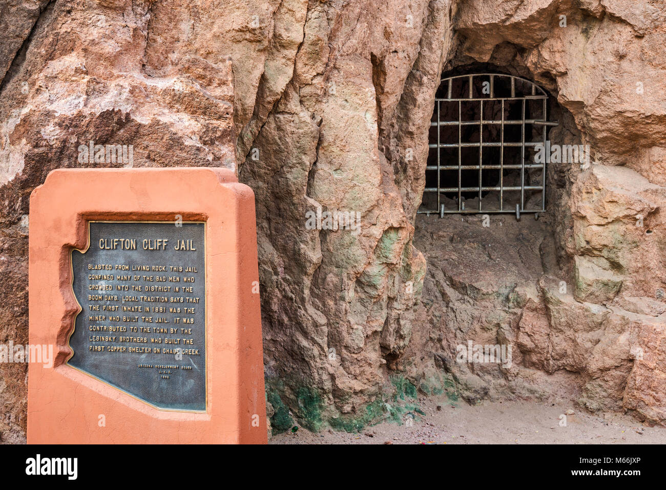 Barred window and sign at Clifton Cliff Jail aka Cliffside Jail in Clifton, Arizona, USA Stock