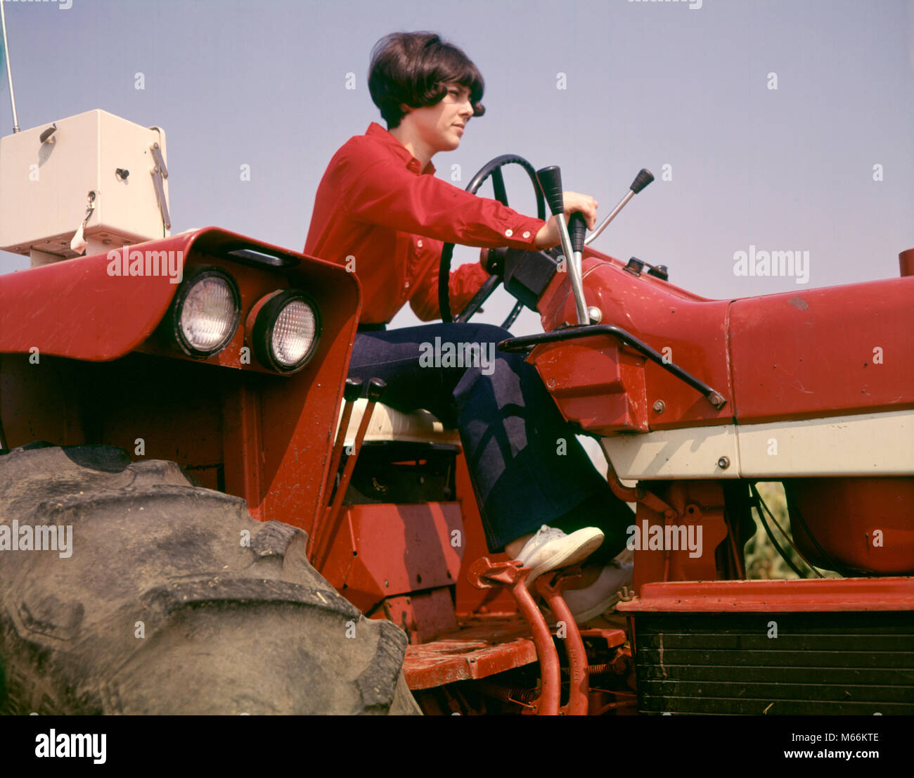 1970s WOMAN FARM WIFE DRIVING FARM TRACTOR TUSCOLA ILLINOIS USA