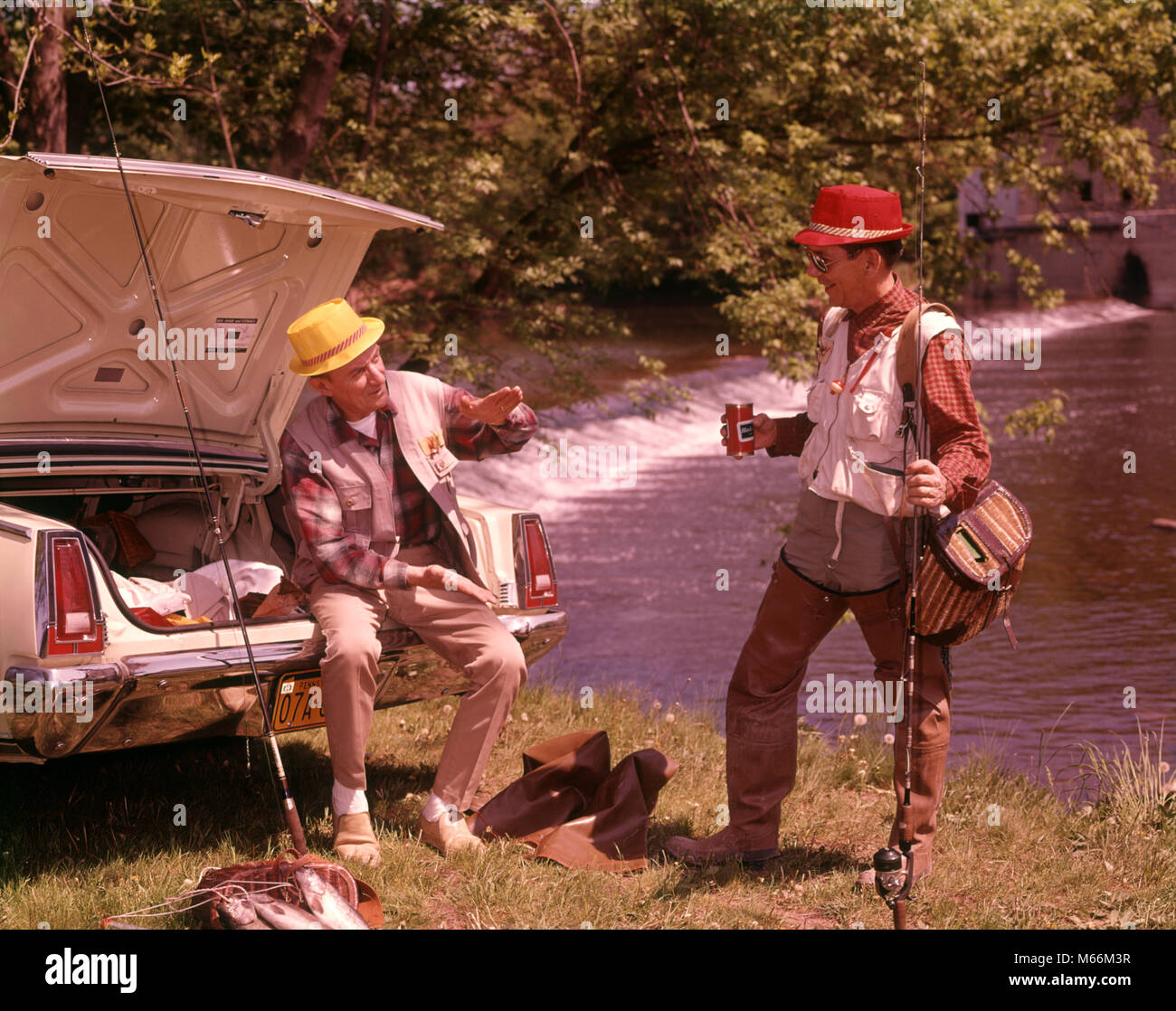 1960s TWO MEN WEARING FISHING GEAR DRINKING BEER TALKING BY OPEN CAR TRUNK ALONG STREAM - kf6293 HAR001 HARS POLE VEHICLE TWO PEOPLE CAUCASIAN ATHLETE RELAXING PLEASED JOY LIFESTYLE SATISFACTION GROWNUP COMMUNICATING TRANSPORT COPY SPACE FRIENDSHIP FULL-LENGTH GROWN-UP STREAM AUTOMOBILE SPEAK TRUNK ANIMALS ATHLETIC TACKLE TRANSPORTATION NOSTALGIA MIDDLE-AGED TOGETHERNESS MIDDLE-AGED MAN SUMMERTIME 45-50 YEARS 50-55 YEARS POLES ALCOHOLIC CHEERFUL BEVERAGE HOBBY LEISURE RELAXATION AUTOS ENJOYING RECREATION SMILES THREE ANIMALS CONNECTION JOYFUL COOPERATION AUTOMOBILES COMMUNICATE MOBILITY Stock Photo
