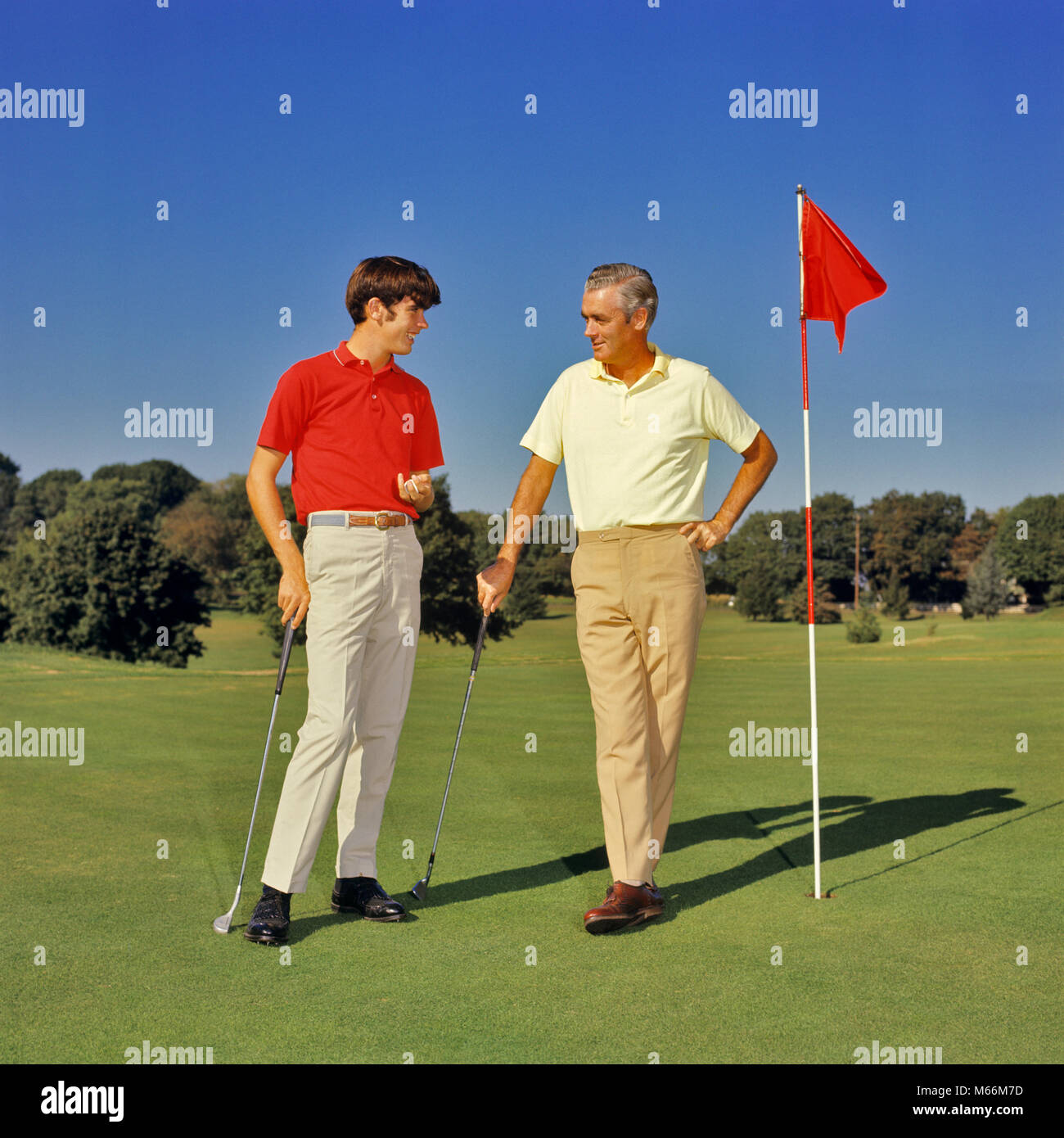 1960s 1970s TEENAGE BOY AND MIDDLEAGED FATHER ON GOLF COURSE GREEN LEANING ON CLUBS TALKING - kg3983 HAR001 HARS EXERCISING HEALTH SPEAKING CLOTHING LISTENING NOSTALGIC PAIR STYLISH SUBURBAN COLOR OLD TIME TEACHING LEANING OLD FASHION 1 FITNESS JUVENILE STYLE COMMUNICATION HEALTHY TEAMWORK TWO PEOPLE COMPETITION CAUCASIAN ATHLETE SONS PLEASED JOY LIFESTYLE SATISFACTION CELEBRATION COPY SPACE FRIENDSHIP FULL-LENGTH ADOLESCENT INSPIRATION CARING TEENAGE BOY ATHLETIC CONFIDENCE NOSTALGIA FATHERS CLUBS TOGETHERNESS 16-17 YEARS 40-45 YEARS 45-50 YEARS SUCCESS ACTIVITY COURSE DREAMS HAPPINESS Stock Photo