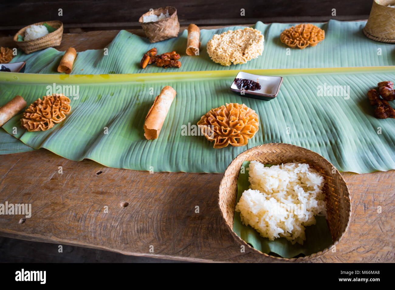 The Laotian Sticky Rice (called “khao niaow”) prepared in many delicious ways. At the living land farm in Luang Prabang, Laos. Stock Photo