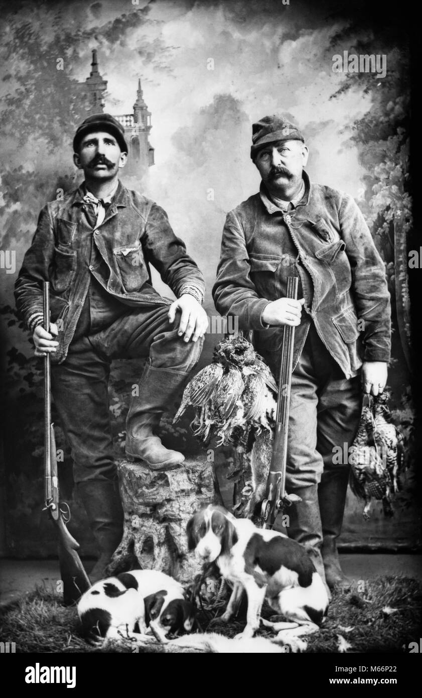 1890s TWO MEN HUNTERS LOOKING AT CAMERA POSED WITH BRACE OF BIRDS DOGS AND SHOTGUNS TURN OF THE 120TH CENTURY - o3469 HAR001 HARS MAMMALS ADVENTURE TURN OF THE 20TH CENTURY AND CANINES RECREATION PRIDE 1890s MASCULINE 19TH CENTURY COOPERATION MANLY SMALL GROUP OF ANIMALS BIRDS CANINE FIREARM FIREARMS HUNTERS MALES MAMMAL POSED SHOTGUNS STIFF B&W BLACK AND WHITE BRACE CAUCASIAN ETHNICITY LOOKING AT CAMERA OLD FASHIONED PERSONS Stock Photo