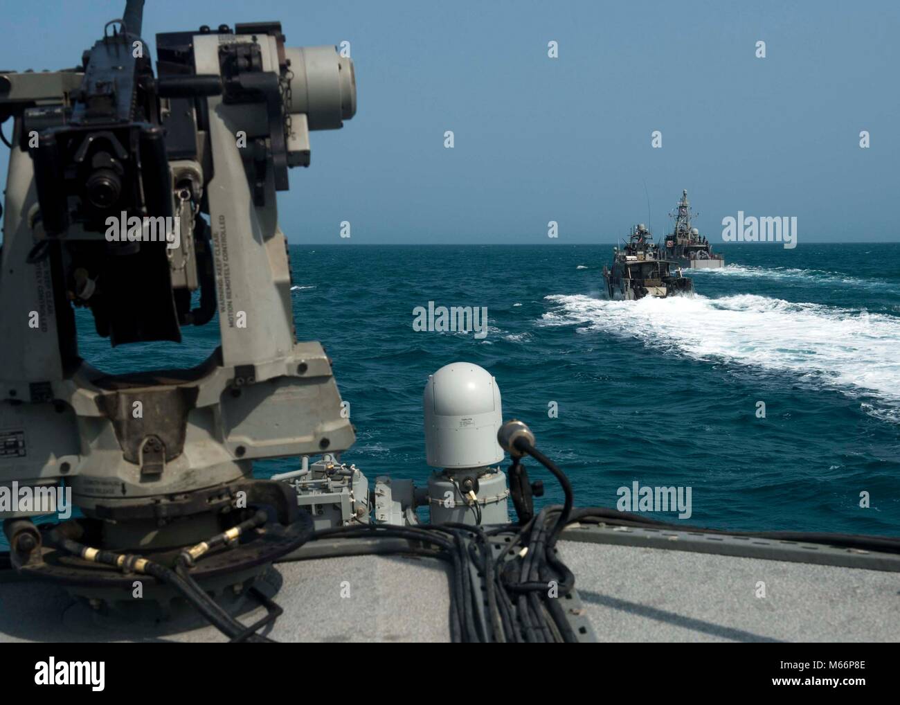 180228-N- IT566-108 MANAMA, Bahrain (Feb. 28, 2018) Mark VI Patrol  patrol Boatsboats, assigned to Coastal Riverine Squadron 4, and the cyclone  cyclone-class coastal patrol ship USS Chinook (PC 9) conduct formation  and tactical maneuvering drills as part of Neon Response 18. Neon Response  18 is a bilateral maritime security and explosive ordnance disposal exercise  between the U.S. Navy and Bahrain Defence ForceBDFdesigned to enhance  interoperability. (U.S. Navy photo by Mass Communication Specialist 1st  Class David Kolmel/Released) Stock Photo
