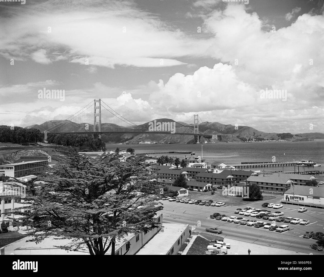 1950s 1960s PRESIDIO ARMY BASE WITH GOLDEN GATE BRIDGE IN BACKGROUND SAN  FRANCISCO CA USA - r10760 MAY001 HARS SUSPENSION BRIDGE Stock Photo - Alamy