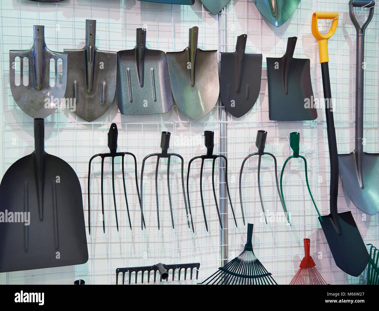 Shovels and forks in the hardware store Stock Photo