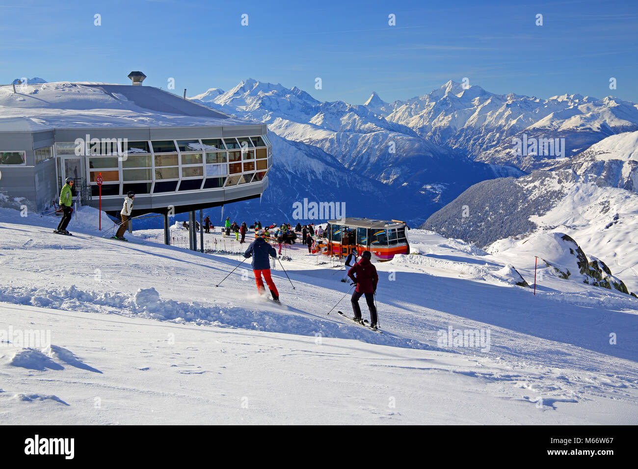 Mountain restaurant at the skiing area on the Bettmerhorn, in the back Dom 4545m, Matterhorn 4478m and Weisshorn 4505m Stock Photo