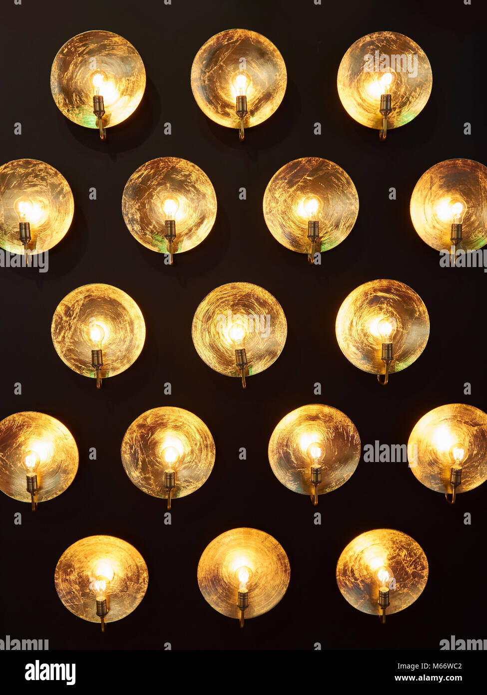 Decorative installation of incandescent lamps and golden reflectors Stock Photo Alamy