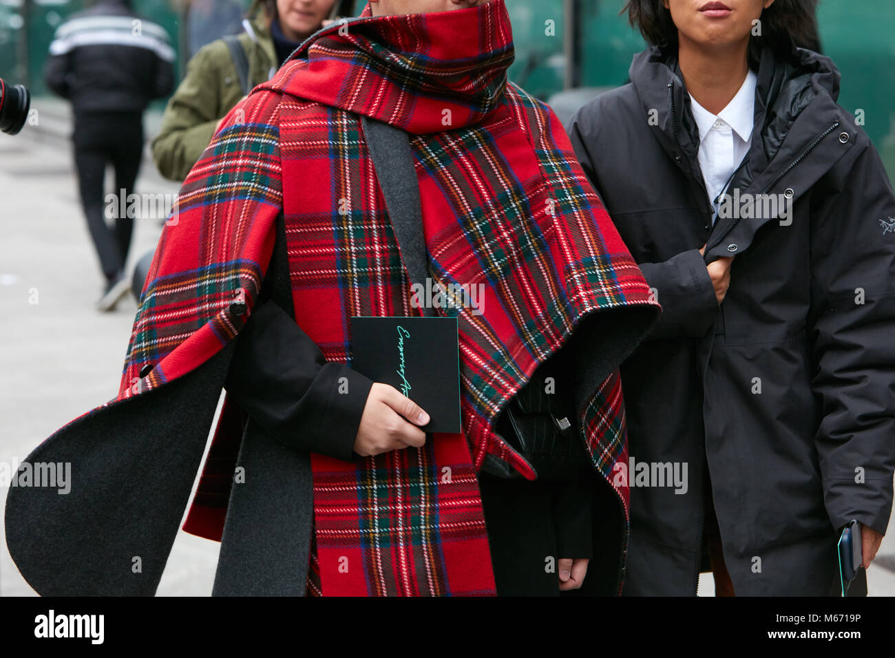 MILAN - FEBRUARY 25: Man with red tartan fabric cloak before Emporio Armani  fashion show, Milan Fashion Week street style on February 25, 2018 in Mila  Stock Photo - Alamy