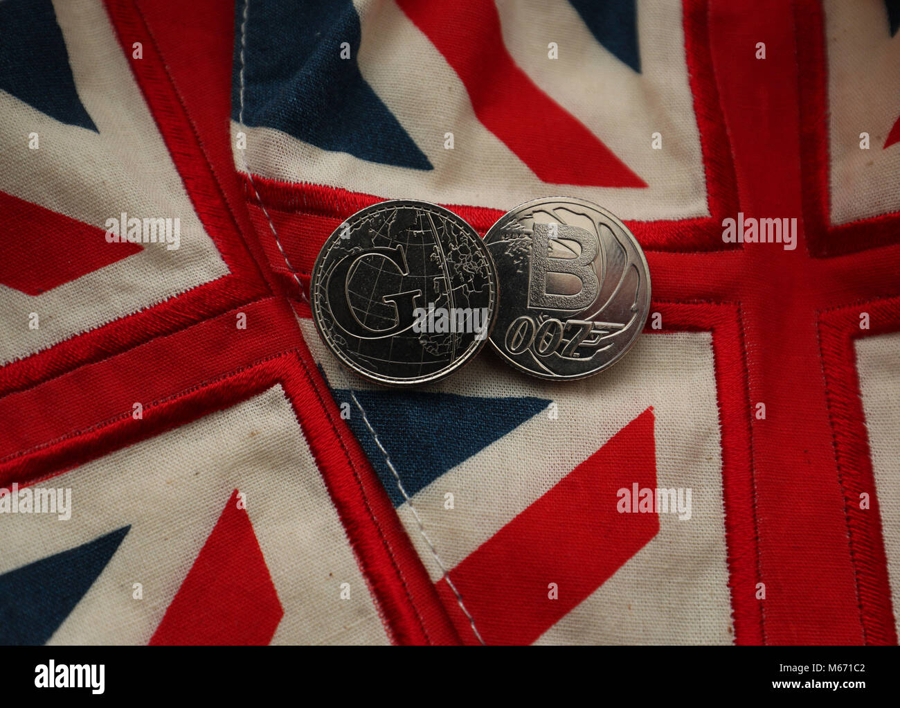 Two of the Royal Mint's 26 brand new 10 pence designs that will appear