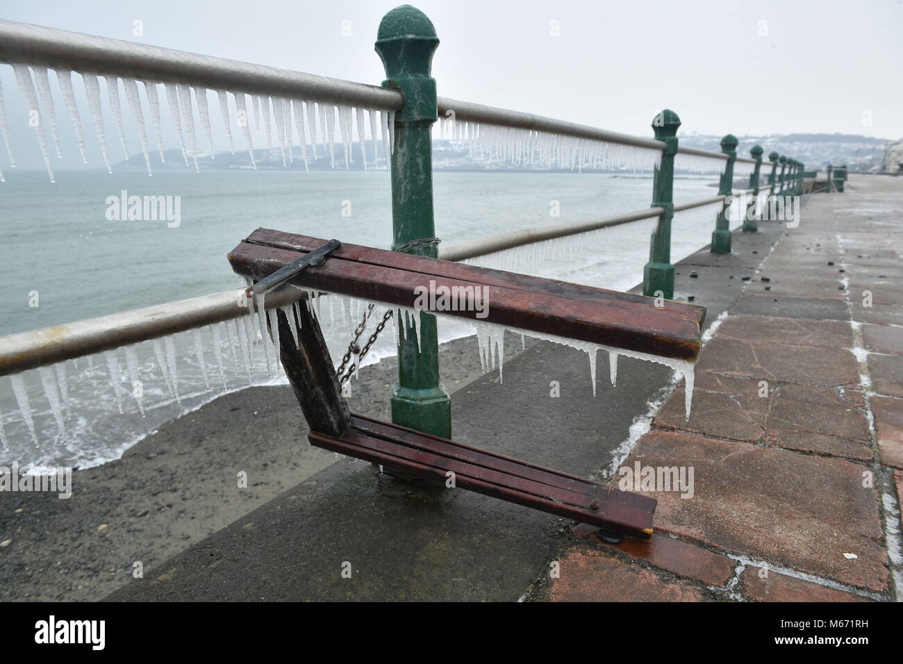 Icicles form on the seafront railings at Penzance in Cornwall, as ...
