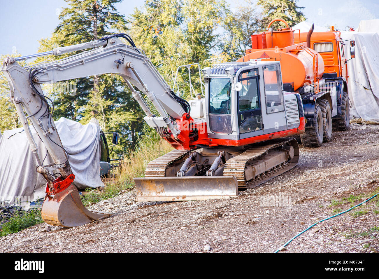 Picture of working excavator in summer day Stock Photo - Alamy