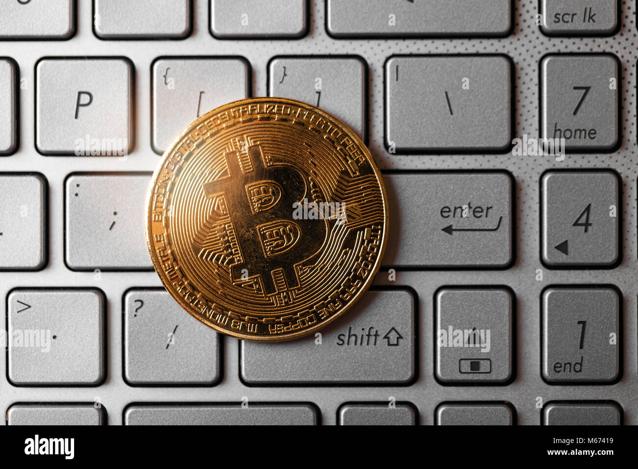 bitcoin on computer keyboard. top view Stock Photo