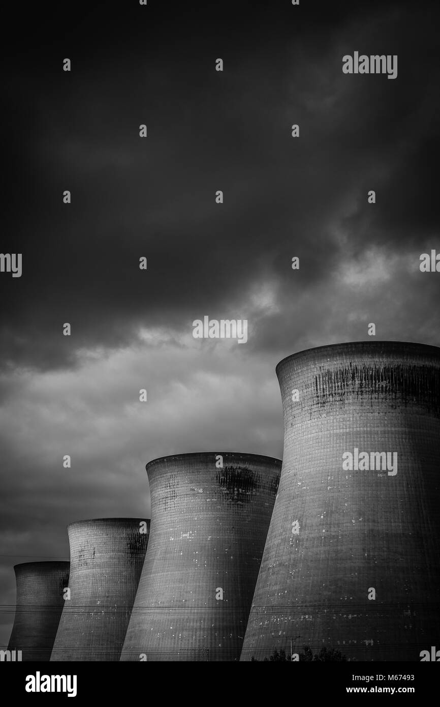 Cooling towers at Ferrybridge power station with a moody cloudy sky in the background Stock Photo