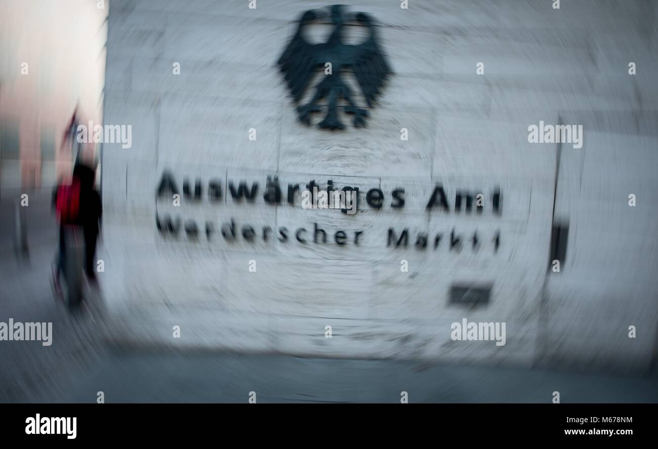 The text 'Auswärtiges Amt' (Foreign Office) visible in the entrance to the building of the Federal Foreign Office in Berlin, Germany, 01 March 2018 (capture with rotating effect). German security authorities have brought under control a hacking attack on the federal government's data network. Photo: Kay Nietfeld/dpa Stock Photo