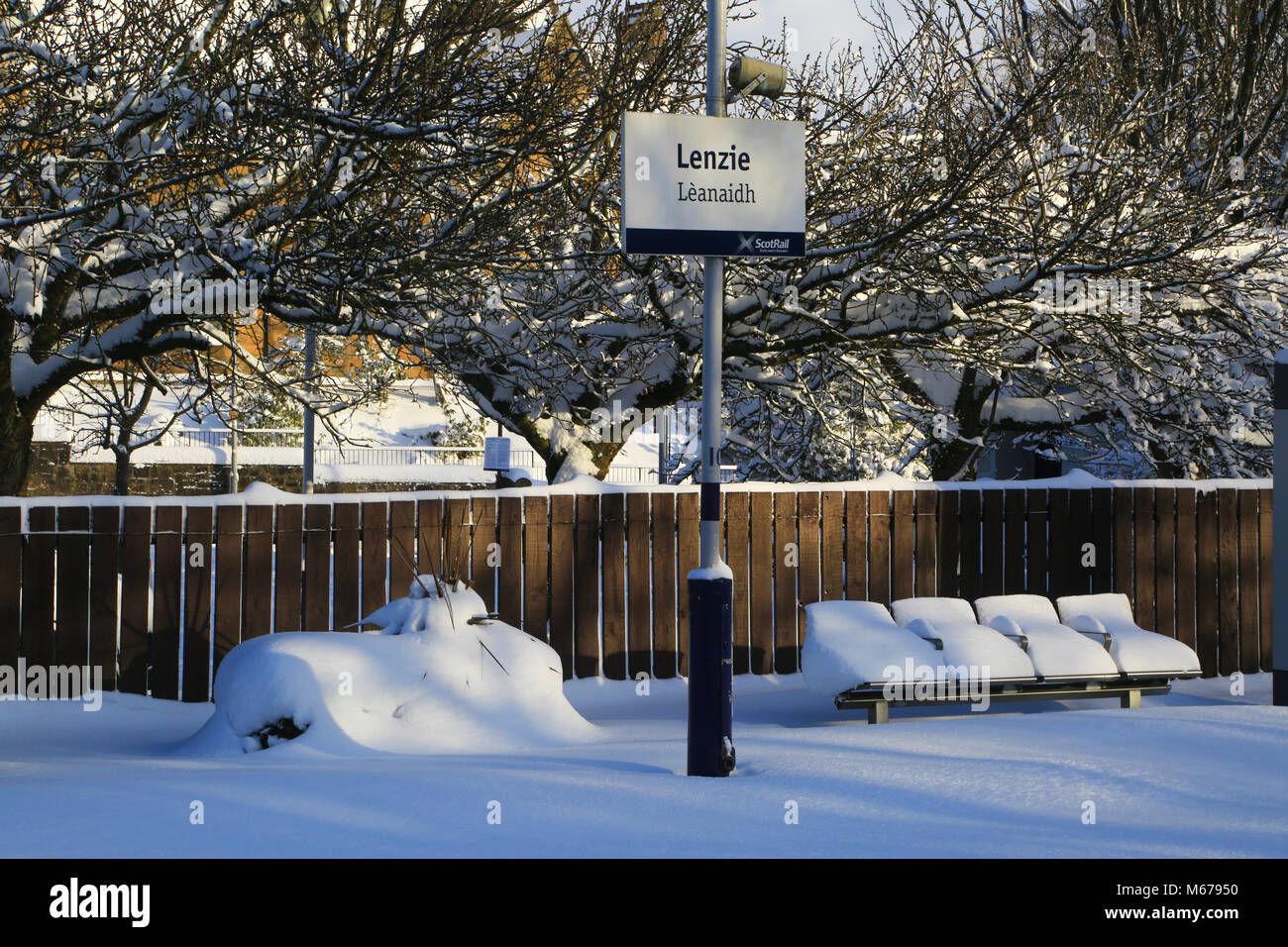 Glasgow, UK. 1st Mar, 2018. UK Weather: Glasgow, UK. 1st Mar, 2018. UK Weather: Winter at Lenzie Station on the Glasgow - Edinburgh Rail Line. The station was closed due to the adverse weather conditions. The snow had covered the rail tracks due to the weather from the Beast from the East. However, there were very few cars on the road and side roads throughout Lenzie were blocked with deep snow. People had generally decided that there were not going to work. Credit: JamieD888/Alamy Live News Credit: JamieD888/Alamy Live News Stock Photo