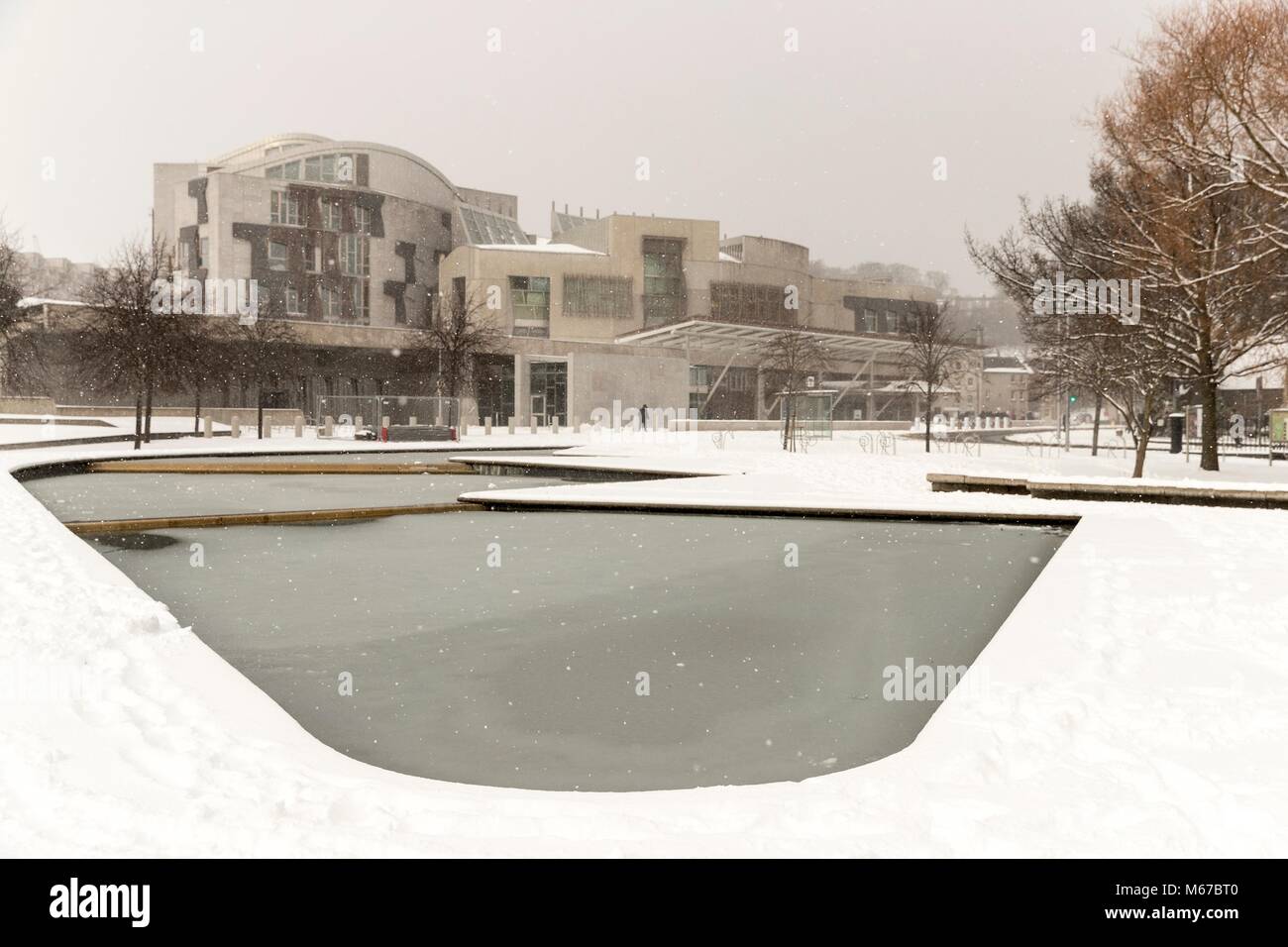 Edinburgh, Scotland, UK. 1st March, 2018. The Beast from the East, Storm Emma hit Edinburgh overnight and has left transport links decimated and many of the shops on the famous Princes Street closed for the day.  Pictured: The Scottish Parliament in the snow Credit: Rich Dyson/Alamy Live News Stock Photo