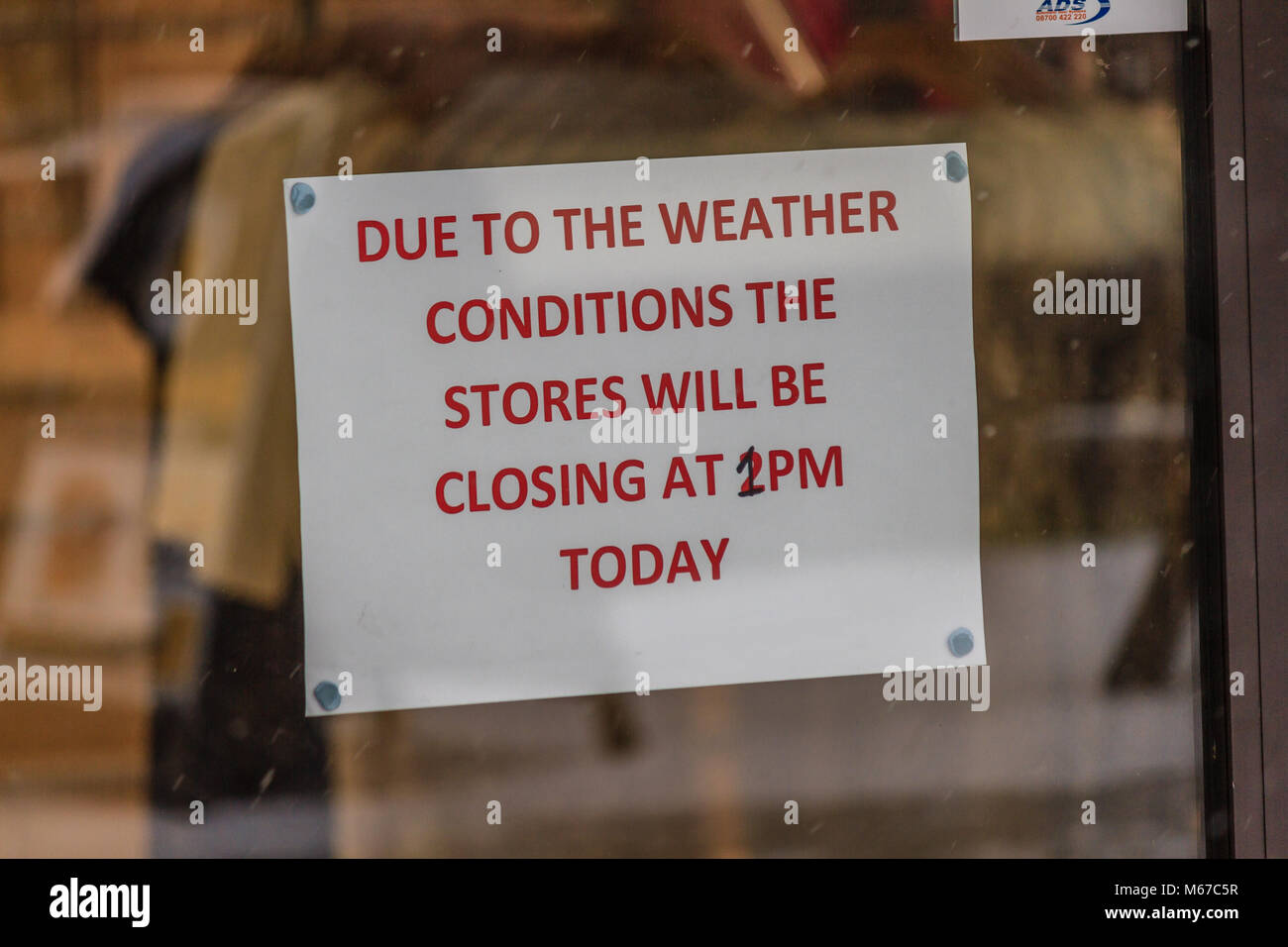 Sign on shop window as parts of Devon grind to a halt as Storm Emma arrives to be met by the cold air from the Beast from the East, causing heavy snow fall and a Red weather warning at Newton Abbot, Devon, UK. Credit: JHNews / Alamy Live News Stock Photo