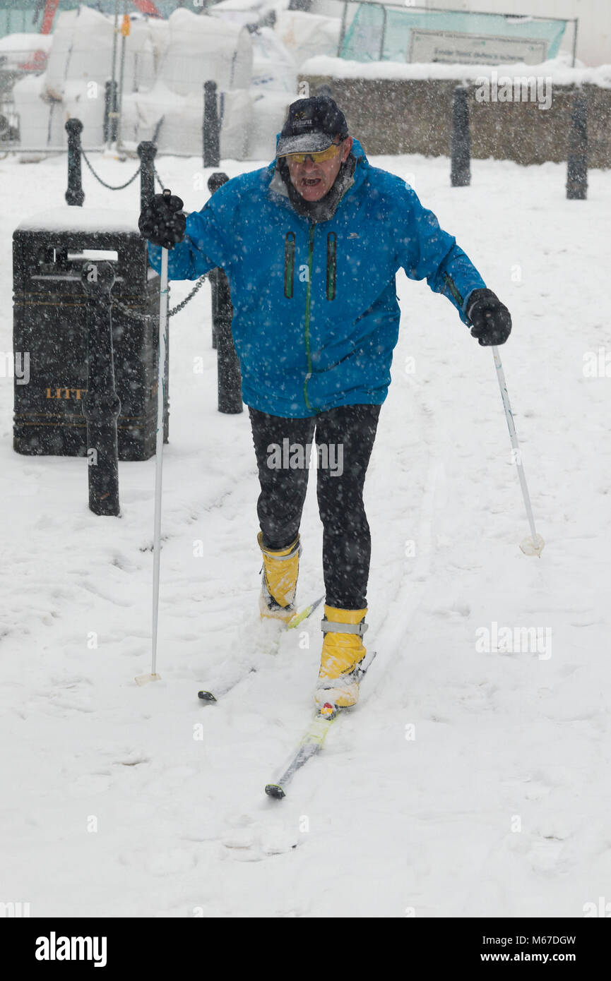 Exeter, Devon, UK. 1st March2018. The Beast from the East meets Storm Emma in Exeter as a red weather warning is issued. A man takes to skis to get around. Credit: Theo Moye/Alamy Live News Stock Photo