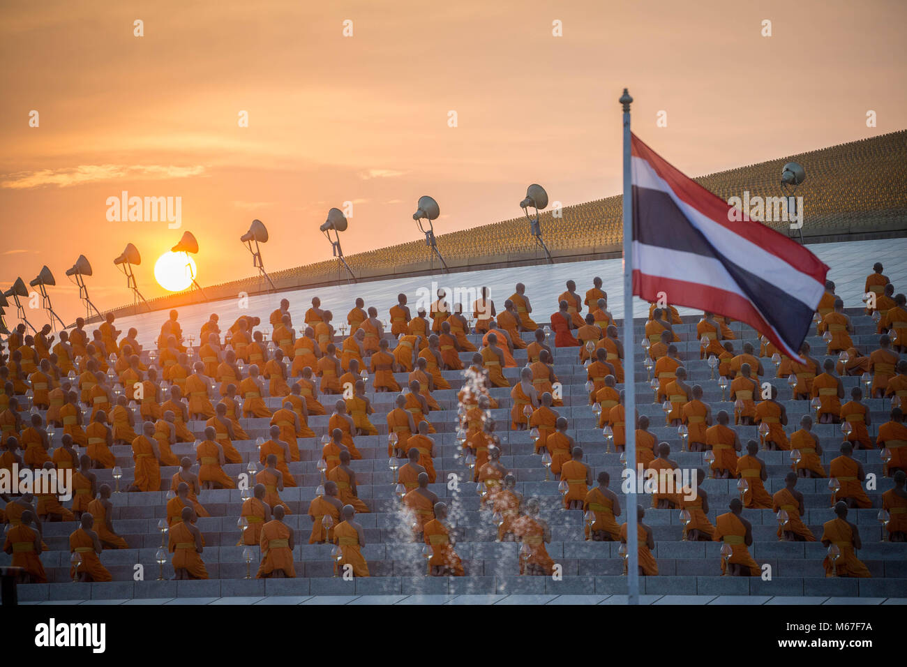 Bangkok Pathum Thani Thailand 1st Mar 18 Monks Seen Praying While Holding Lanterns As The Sun Goes Down During The Yearly Makha Bucha Ceremony In The North Of Bangkok Buddhist Devotees Celebrate The