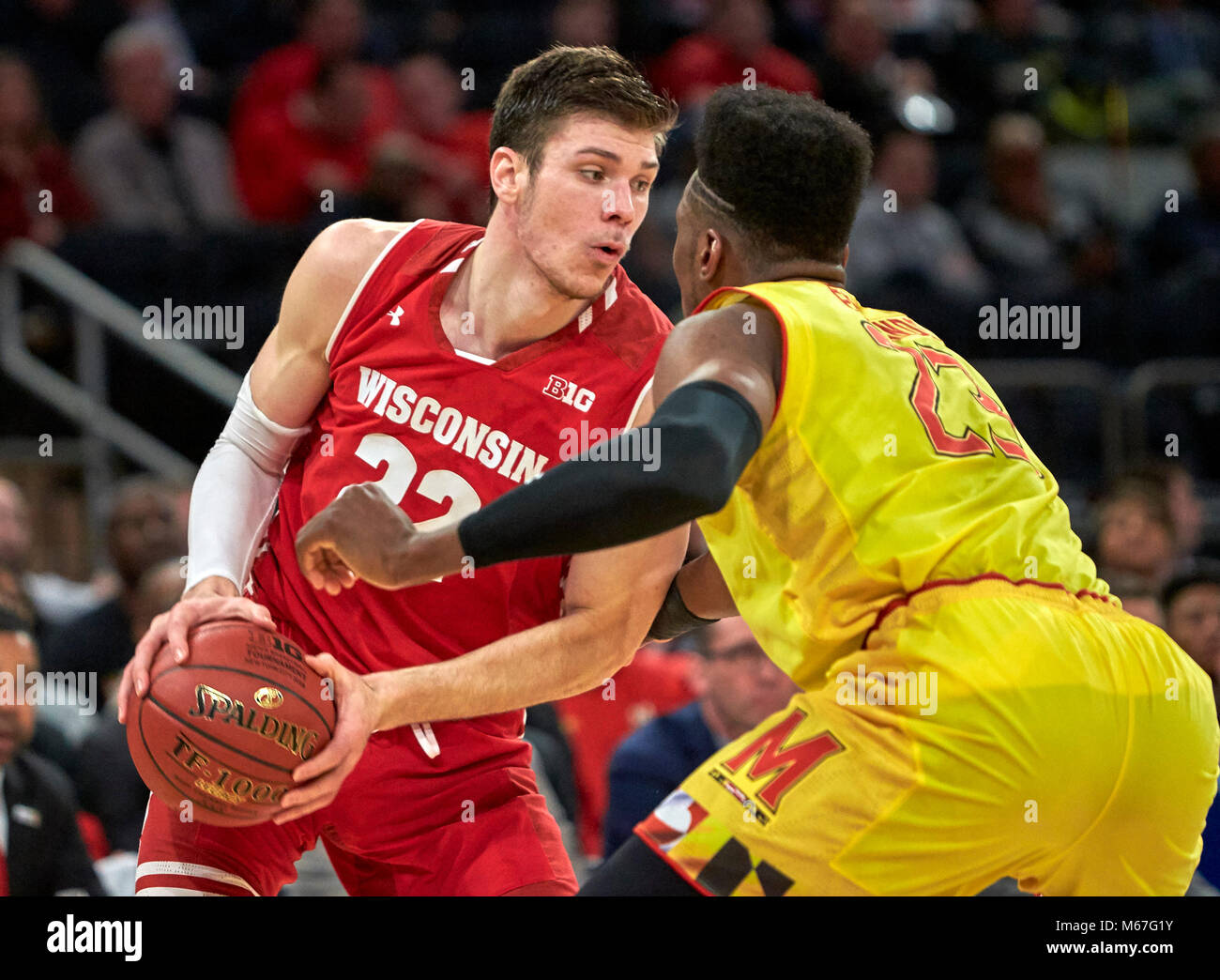 New York, New York, USA. 1st Mar, 2018. Wisconsin Badgers forward Ethan Happ (22) gets pressure from Maryland Terrapins forward Bruno Fernando (23) in the first half during the second round of Big Ten Conference Tournament play at Madison Square Garden in New York City. Duncan Williams/CSM/Alamy Live News Stock Photo
