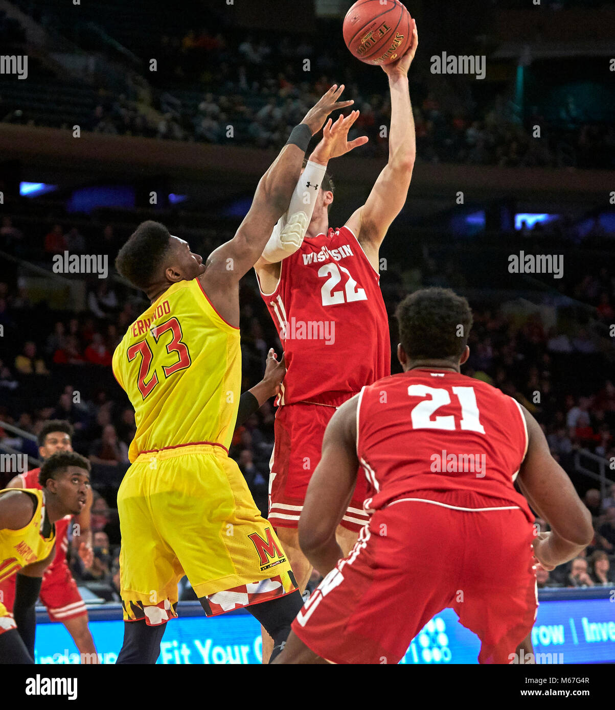New York, New York, USA. 1st Mar, 2018. Wisconsin Badgers forward Ethan Happ (22) shoots over Maryland Terrapins forward Bruno Fernando (23) in the first half during the second round of Big Ten Conference Tournament play at Madison Square Garden in New York City. Duncan Williams/CSM/Alamy Live News Stock Photo