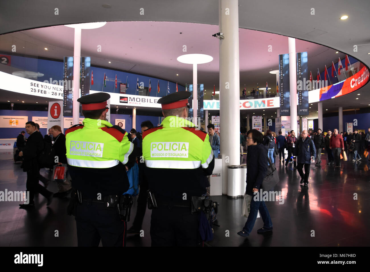 Barcelona, Spain. 1st Mar, 2018. Two agents of the Catalan Police guard access to the Mobile World Congress.The Mobile World Congress 2018 is being hosted in Barcelona from 26 February to 1st March. Credit: Workers that make possible the MWC7  7 .jpg/SOPA Images/ZUMA Wire/Alamy Live News Stock Photo