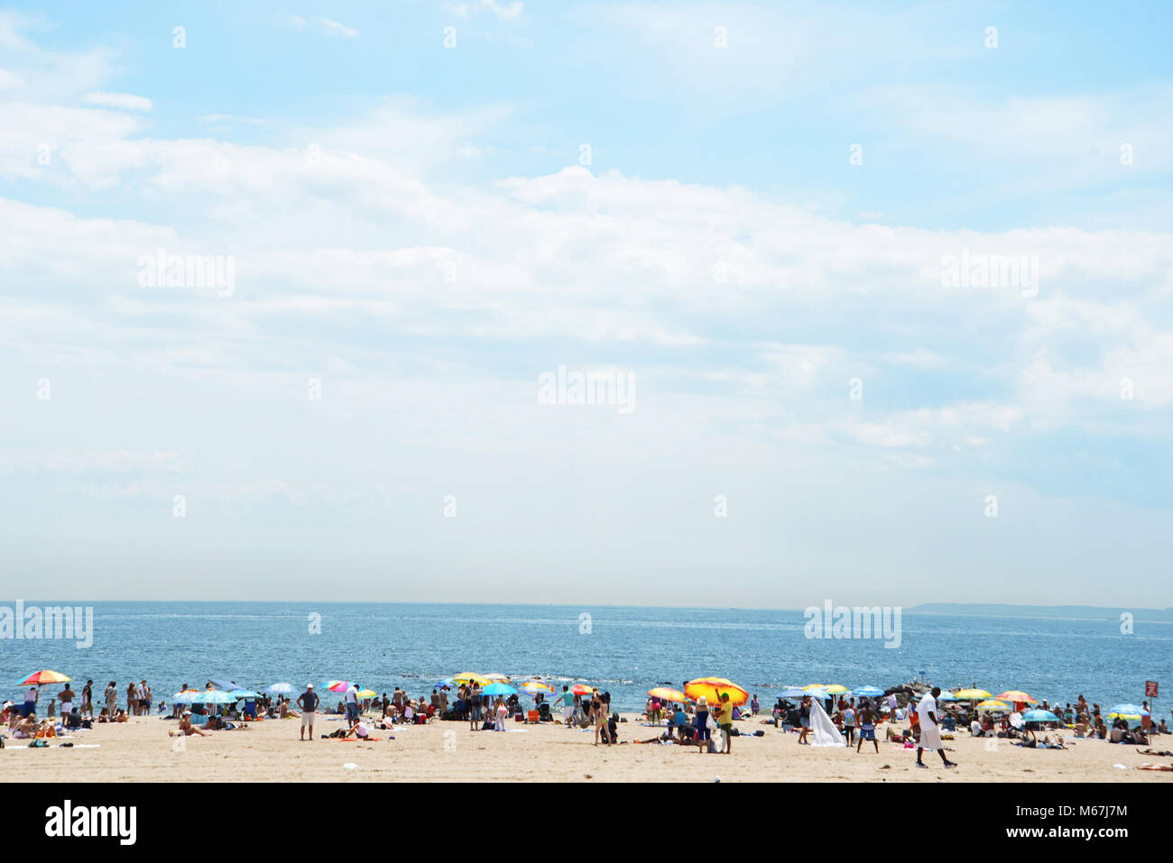 People enjoying Coney island beach Stock Photo - Alamy
