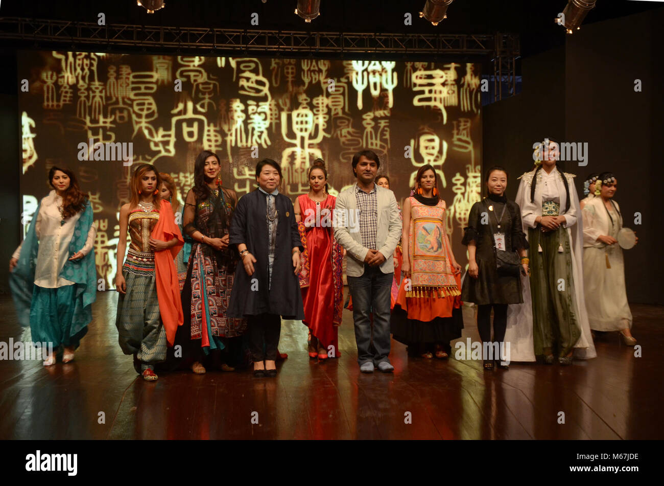 Pakistani And Chinese Artist Perform On Stage Wearing Traditional 