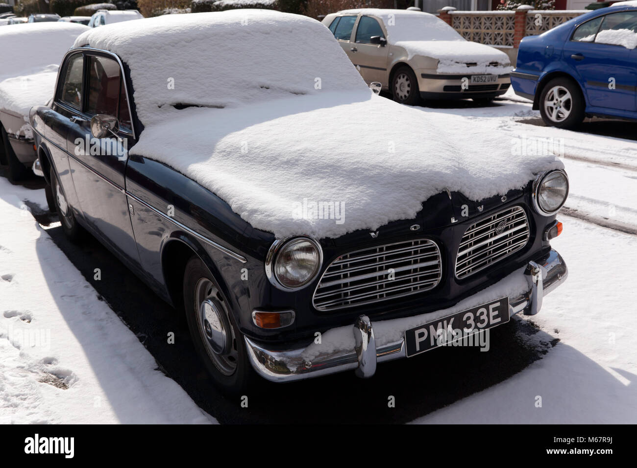 A Volvo 121  covered in Snow, Fossil Road, Lewisham, South East London Stock Photo