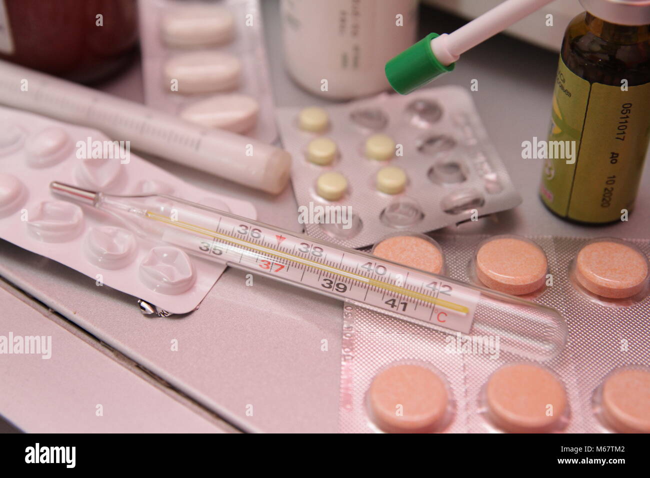Vitamin c tablet and pills stack with thermometer Stock Photo Alamy
