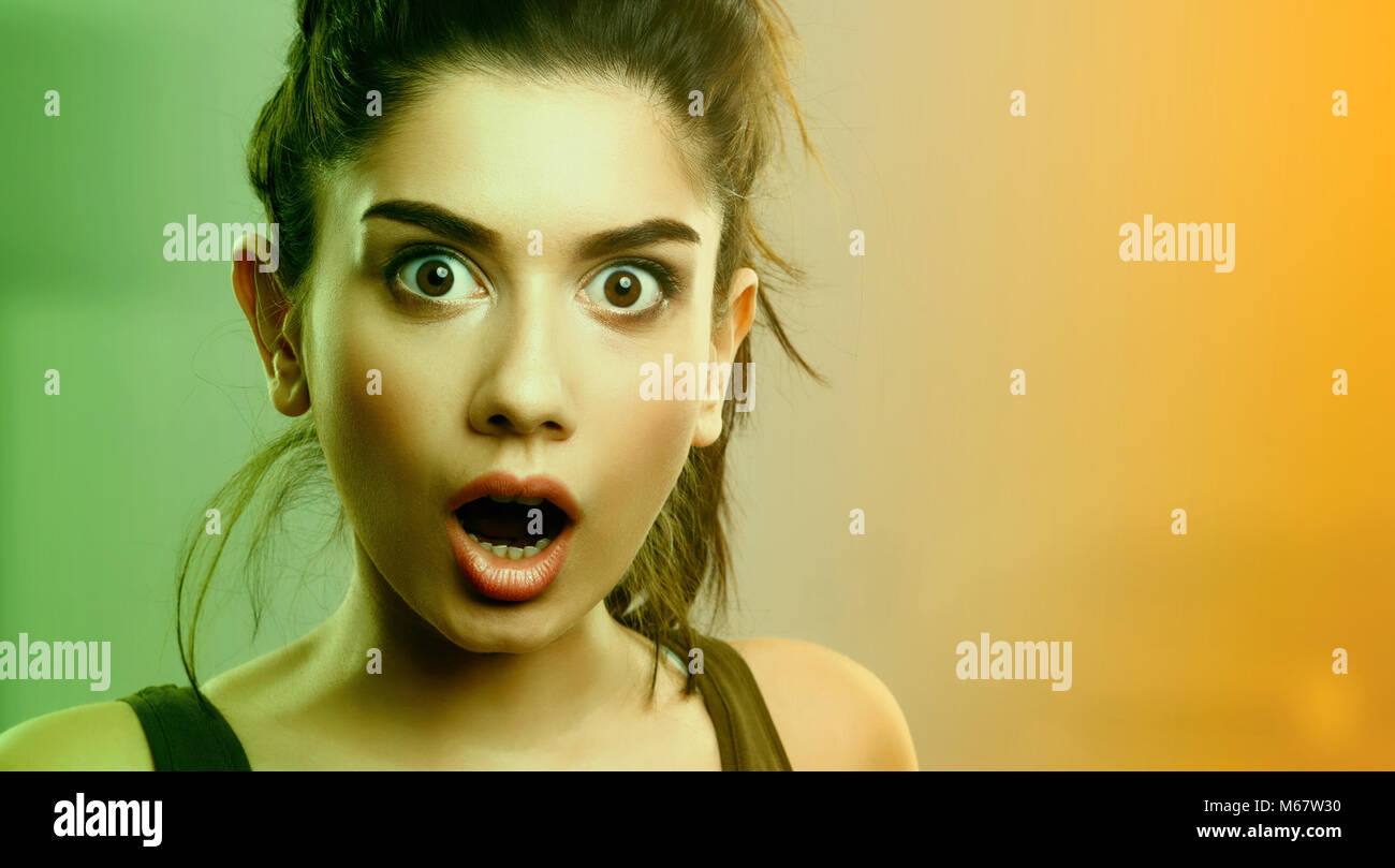 Face expression of shocked surprised young cute woman Stock Photo