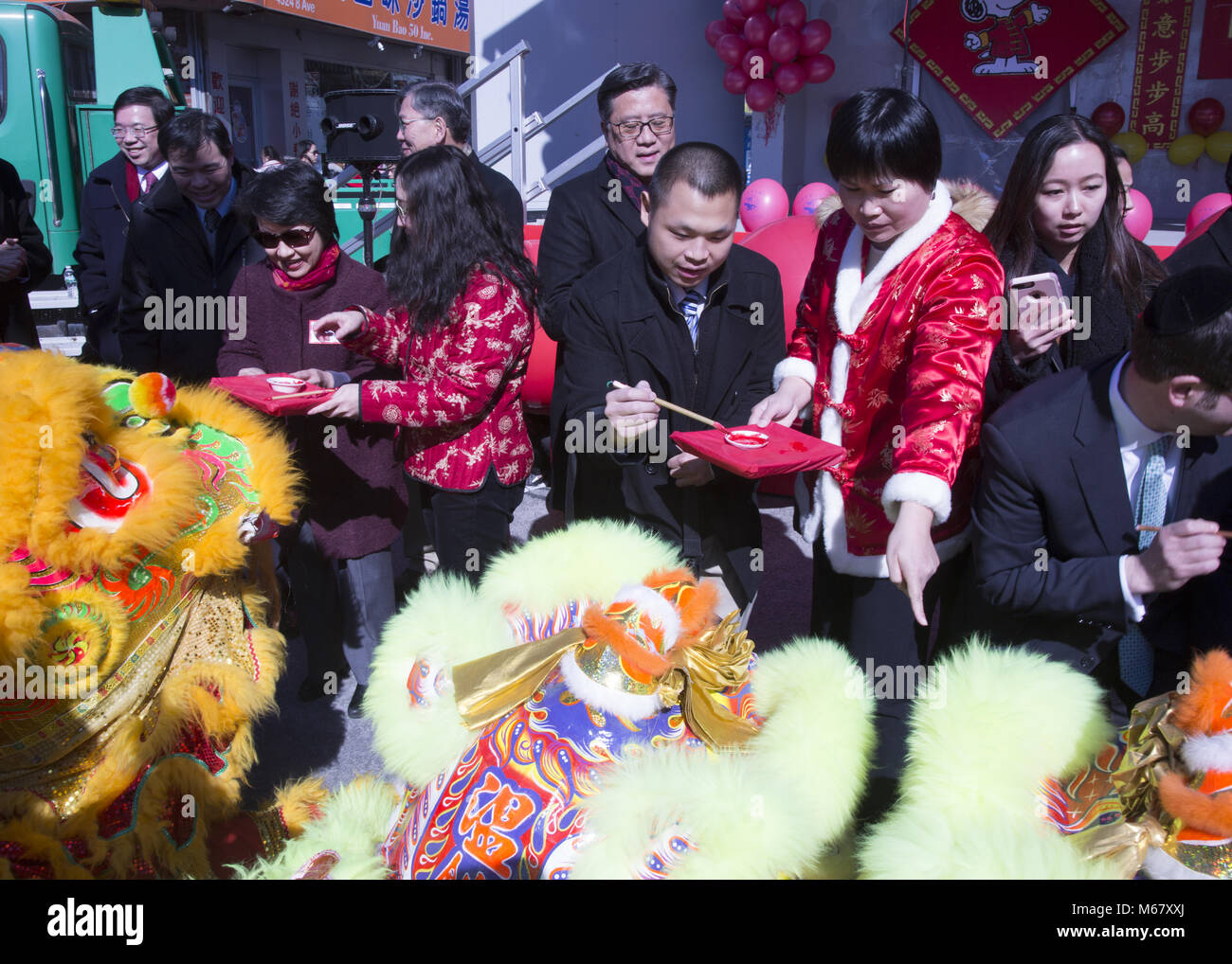 Chinese New Year, Brooklyn, NY. In traditional southern lion dance, before the ‘lions’ do their performances, the ‘animal’ must be blessed by an eye opening or eye dotting ceremony. The red color is used because the color is associated with fire, life and good luck or fortune. Stock Photo