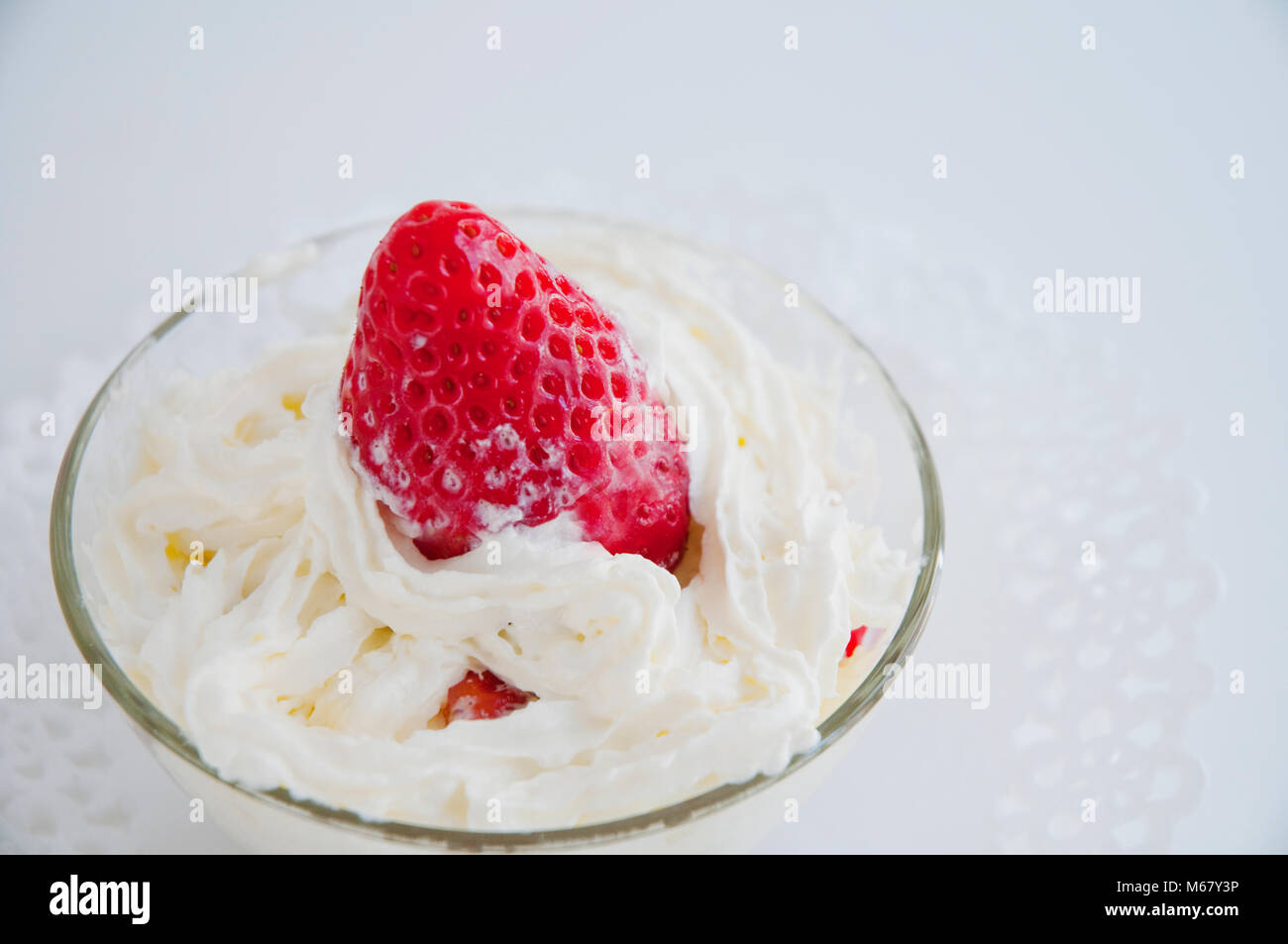 Strawberry with cream. Close view. Stock Photo