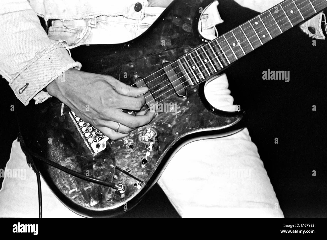 Fingers on guitar strings Black and White Stock Photos Images