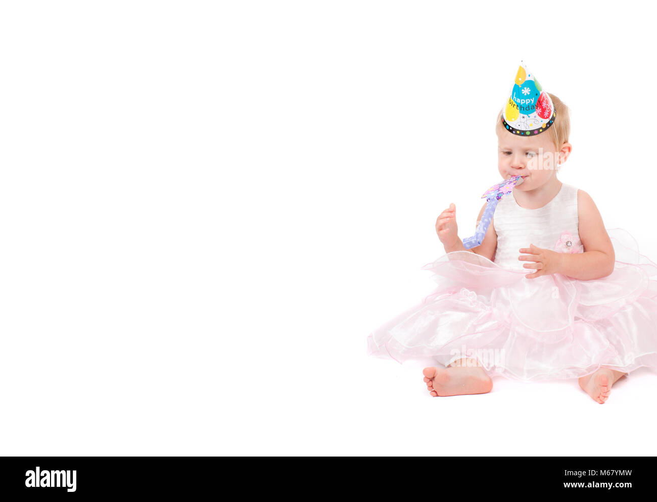 The baby girl in a pink dress isolated on the white background Stock ...